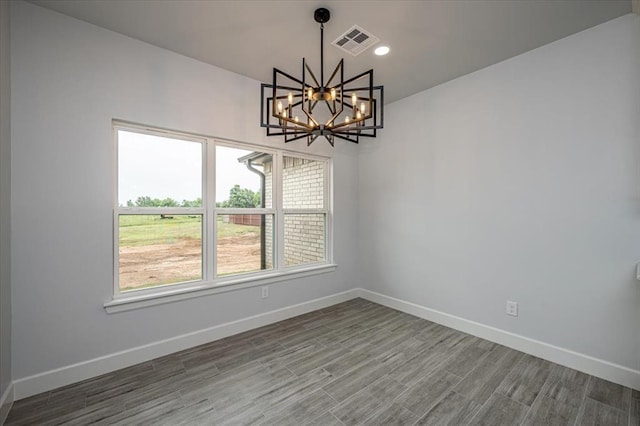 1890 E Industrial Rd, Guthrie, OK 73044 - unfurnished dining area featuring a chandelier, wood finished floors, and recessed lighting