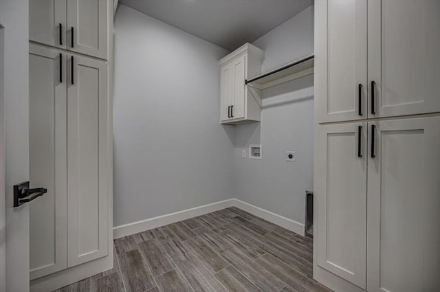 1890 E Industrial Rd, Guthrie, OK 73044 - laundry area featuring hookup for an electric dryer, cabinet space, hookup for a washing machine, and wood finish floors