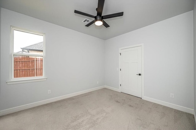 1890 E Industrial Rd, Guthrie, OK 73044 - carpeted empty room with ceiling fan and baseboards