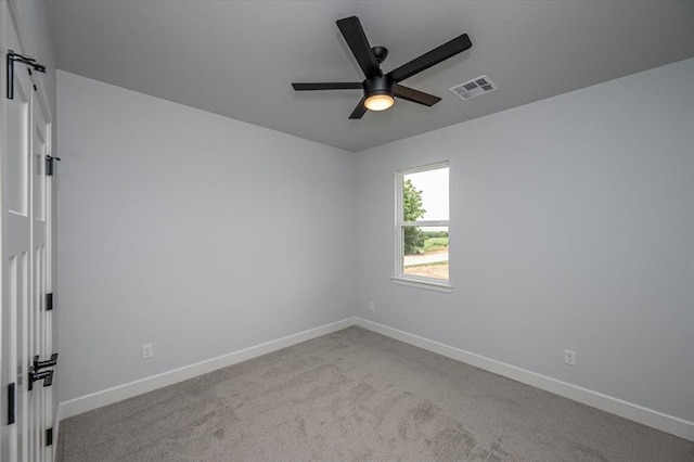 1890 E Industrial Rd, Guthrie, OK 73044 - carpeted spare room with ceiling fan and baseboards