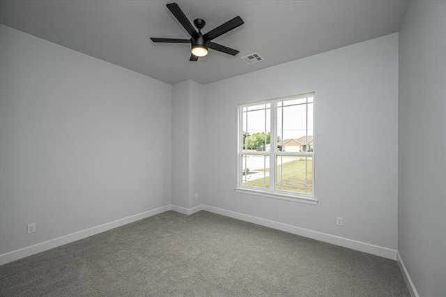 1890 E Industrial Rd, Guthrie, OK 73044 - carpeted spare room featuring a ceiling fan and baseboards