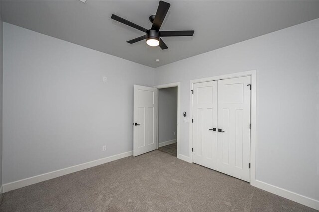 1890 E Industrial Rd, Guthrie, OK 73044 - unfurnished bedroom with carpet, a closet, and ceiling fan