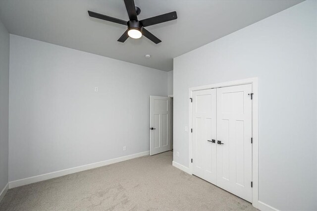 1890 E Industrial Rd, Guthrie, OK 73044 - unfurnished bedroom with light carpet, a closet, and ceiling fan