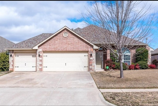 1205 NW 190th Pl, Edmond, OK 73012 - ranch-style home featuring a garage, concrete driveway, brick siding, and a shingled roof