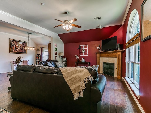 1205 NW 190th Pl, Edmond, OK 73012 - living area with vaulted ceiling, ceiling fan, dark wood-style floors, a fireplace, and ornamental molding