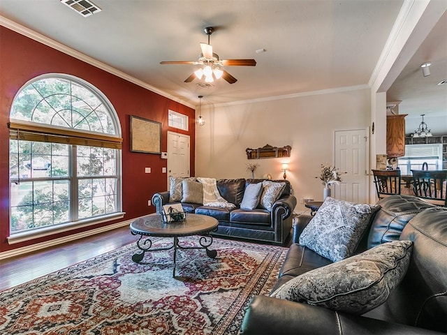 1205 NW 190th Pl, Edmond, OK 73012 - living area with a ceiling fan, wood finished floors, and ornamental molding