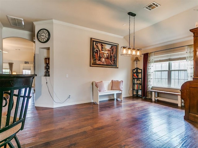 1205 NW 190th Pl, Edmond, OK 73012 - sitting room featuring wood finished floors, ornamental molding, and arched walkways