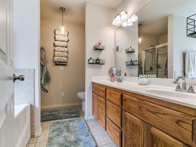 1205 NW 190th Pl, Edmond, OK 73012 - full bath with double vanity, a garden tub, a shower stall, and tile patterned floors