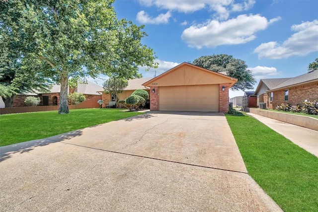 3217 Quail Cir, Altus, OK 73521 - view of front of home with brick siding, driveway, and a garage