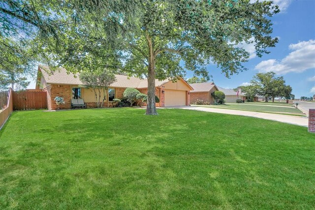 3217 Quail Cir, Altus, OK 73521 - ranch-style home with driveway, an attached garage, and brick siding