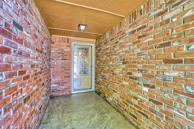 3217 Quail Cir, Altus, OK 73521 - doorway to property featuring brick siding