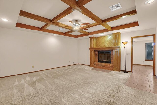 3217 Quail Cir, Altus, OK 73521 - unfurnished living room with light carpet, coffered ceiling, a brick fireplace, beamed ceiling, and a ceiling fan