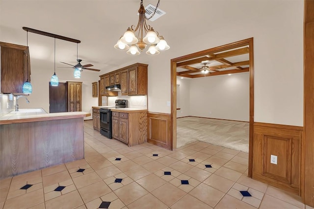 3217 Quail Cir, Altus, OK 73521 - kitchen featuring black electric range oven, ceiling fan, coffered ceiling, under cabinet range hood, and light countertops