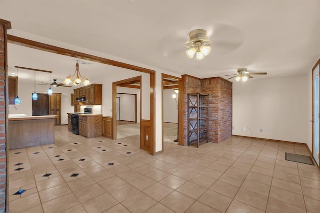 3217 Quail Cir, Altus, OK 73521 - kitchen featuring black / electric stove, ceiling fan, and light tile patterned floors