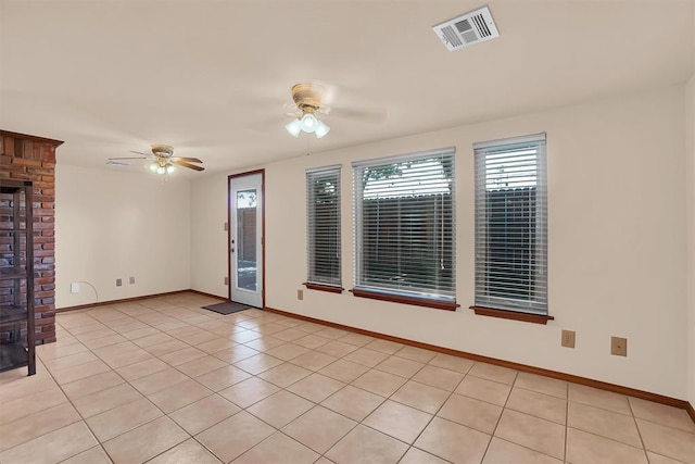 3217 Quail Cir, Altus, OK 73521 - spare room with a ceiling fan and light tile patterned flooring