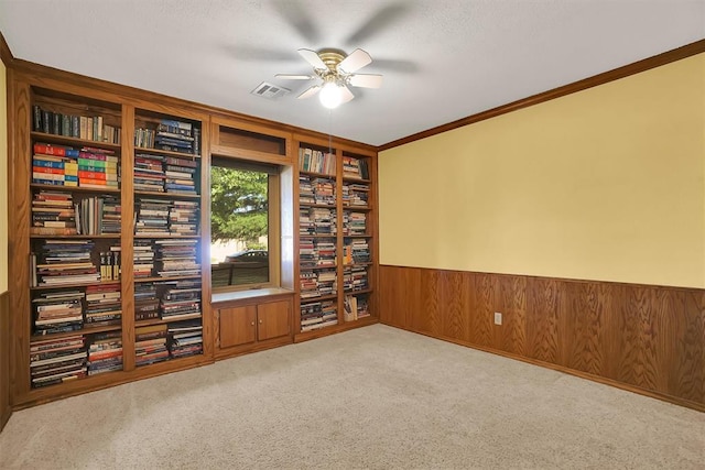3217 Quail Cir, Altus, OK 73521 - unfurnished office with ceiling fan, a wainscoted wall, carpet flooring, wood walls, and crown molding
