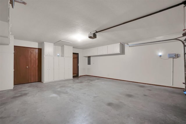 3217 Quail Cir, Altus, OK 73521 - garage with electric panel and a garage door opener