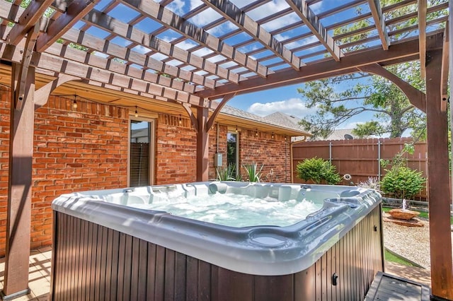 3217 Quail Cir, Altus, OK 73521 - view of patio featuring a hot tub and a pergola