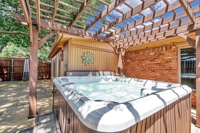 3217 Quail Cir, Altus, OK 73521 - view of patio / terrace with a hot tub and a pergola