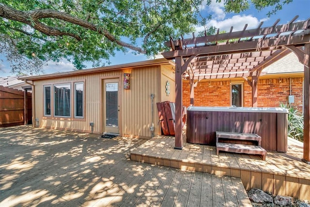 3217 Quail Cir, Altus, OK 73521 - back of house featuring a hot tub, a wooden deck, a pergola, and brick siding