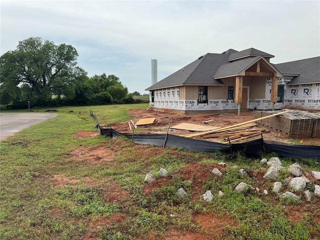2757 Sherwood Ct, Newcastle, OK 73065 - rear view of house with board and batten siding and a lawn