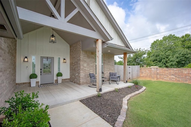 1540 17th Pl, Newcastle, OK 73065 - view of exterior entry with board and batten siding, covered porch, and brick siding