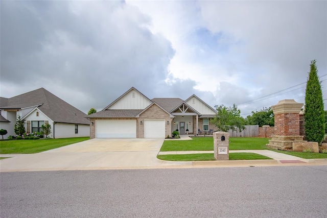 1540 17th Pl, Newcastle, OK 73065 - view of front of home with an attached garage, driveway, board and batten siding, and brick siding