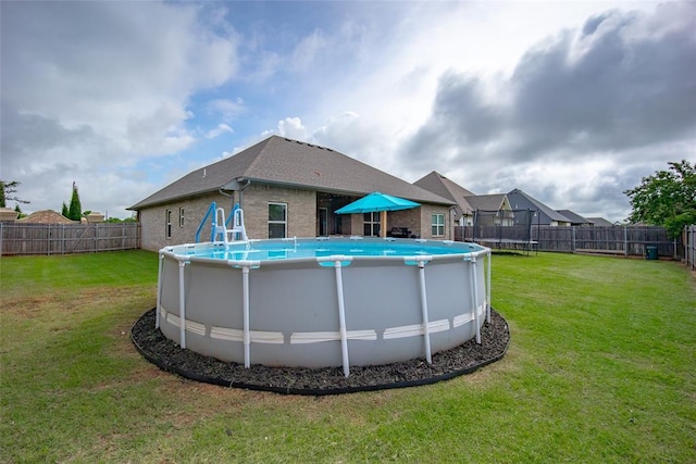 1540 17th Pl, Newcastle, OK 73065 - view of swimming pool with a trampoline and a fenced backyard