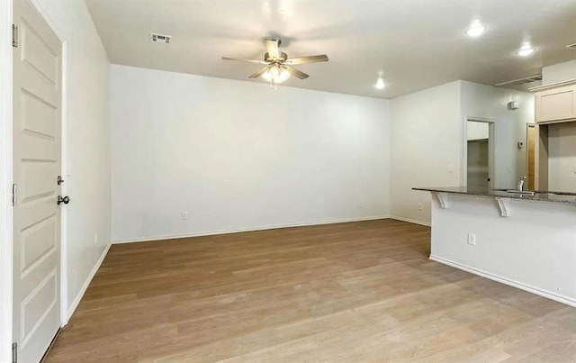 1426 SW Oklahoma Ave, Lawton, OK 73501 - unfurnished living room featuring ceiling fan, light wood-style floors, and recessed lighting