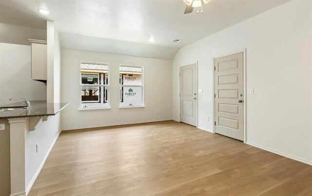 1426 SW Oklahoma Ave, Lawton, OK 73501 - unfurnished living room featuring light wood-style floors, a ceiling fan, lofted ceiling, and recessed lighting