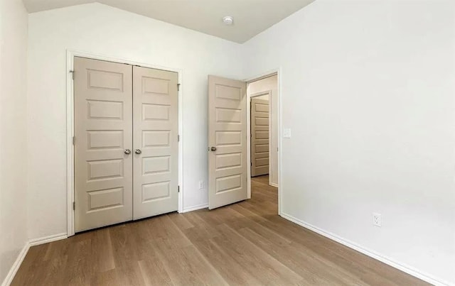 1426 SW Oklahoma Ave, Lawton, OK 73501 - unfurnished bedroom with wood finished floors and a closet