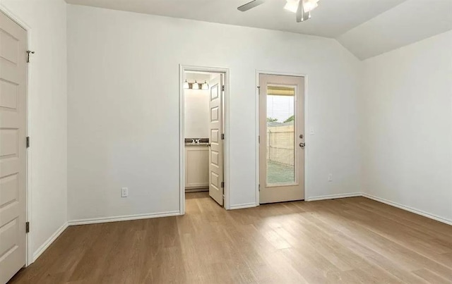 1426 SW Oklahoma Ave, Lawton, OK 73501 - unfurnished bedroom featuring light wood-style floors, vaulted ceiling, a ceiling fan, and ensuite bath
