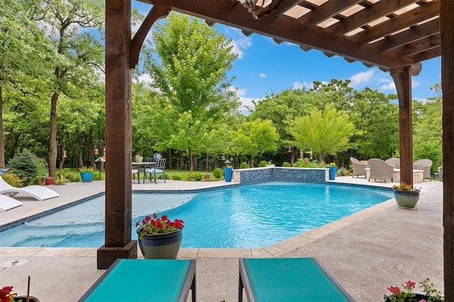 1605 Hidden Lake Dr, Edmond, OK 73034 - outdoor pool with outdoor dining space, a patio, and view of wooded area