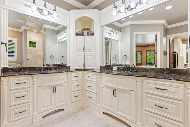 1605 Hidden Lake Dr, Edmond, OK 73034 - bathroom with double vanity, crown molding, recessed lighting, and a tile shower