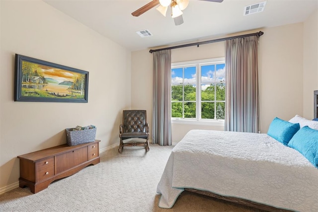 1605 Hidden Lake Dr, Edmond, OK 73034 - carpeted bedroom with baseboards and a ceiling fan