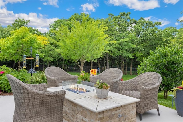 1605 Hidden Lake Dr, Edmond, OK 73034 - view of patio featuring a fire pit and view of wooded area