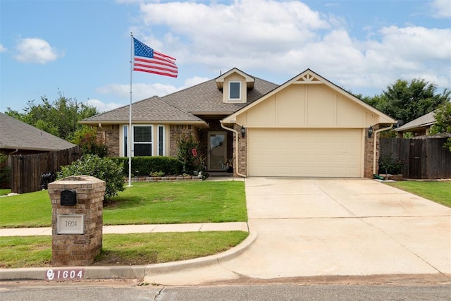 1604 Central Pkwy, Norman, OK 73071 - view of front of property featuring a garage, concrete driveway, brick siding, and roof with shingles
