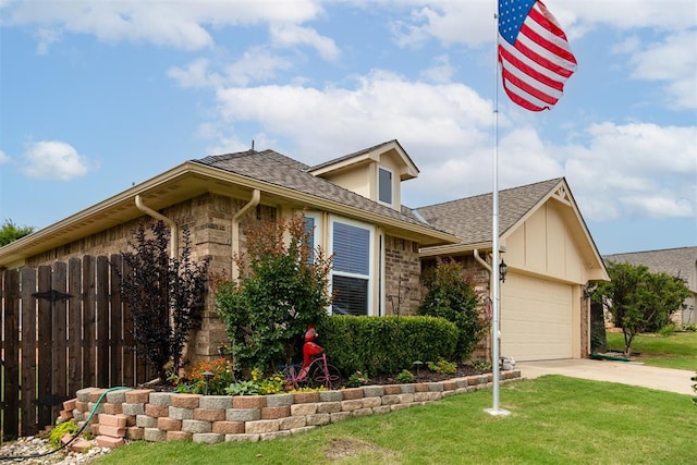 1604 Central Pkwy, Norman, OK 73071 - view of front of house featuring roof with shingles, concrete driveway, an attached garage, and stone siding