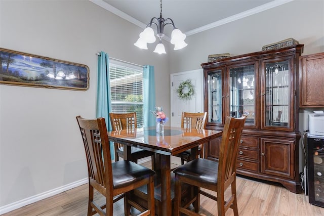 1604 Central Pkwy, Norman, OK 73071 - dining room featuring a chandelier, light wood finished floors, and ornamental molding