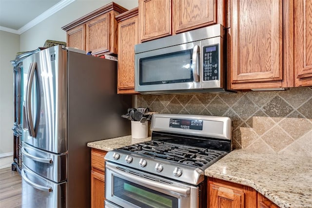 1604 Central Pkwy, Norman, OK 73071 - kitchen with appliances with stainless steel finishes, crown molding, brown cabinetry, decorative backsplash, and light stone counters