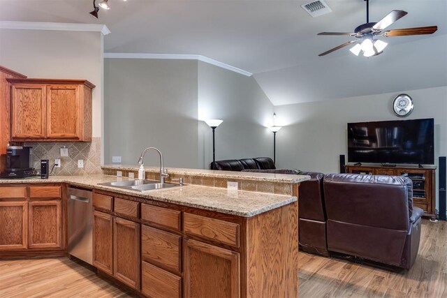 1604 Central Pkwy, Norman, OK 73071 - kitchen featuring stainless steel dishwasher, open floor plan, a peninsula, light wood-type flooring, and brown cabinets