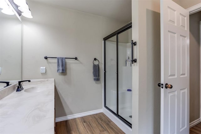 1604 Central Pkwy, Norman, OK 73071 - full bathroom featuring a shower stall, vanity, wood finished floors, and a chandelier