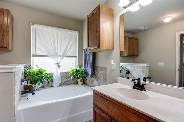 1604 Central Pkwy, Norman, OK 73071 - bathroom featuring a garden tub and vanity