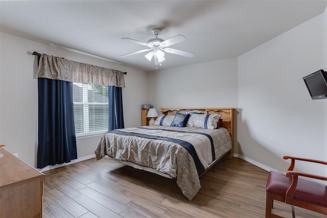 1604 Central Pkwy, Norman, OK 73071 - bedroom with wood finished floors and a ceiling fan