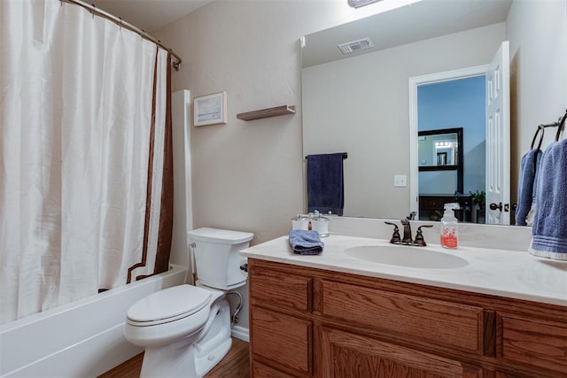 1604 Central Pkwy, Norman, OK 73071 - bathroom featuring vanity, shower / tub combo with curtain, and wood finished floors