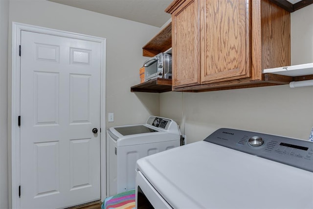 1604 Central Pkwy, Norman, OK 73071 - laundry room featuring independent washer and dryer and cabinet space