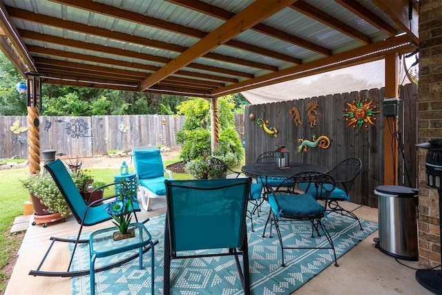 1604 Central Pkwy, Norman, OK 73071 - fenced backyard with outdoor dining area and a patio
