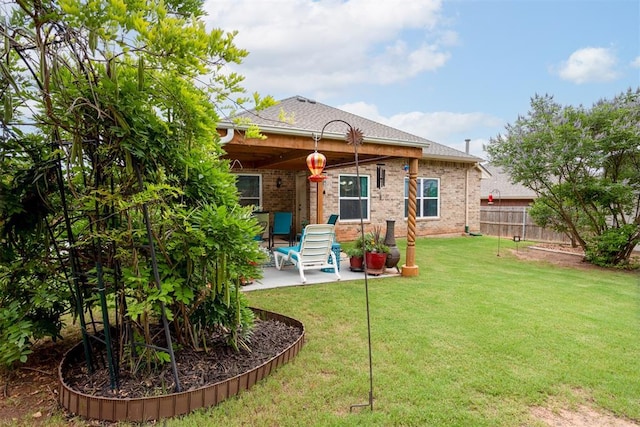 1604 Central Pkwy, Norman, OK 73071 - back of property featuring a patio area, brick siding, and a shingled roof