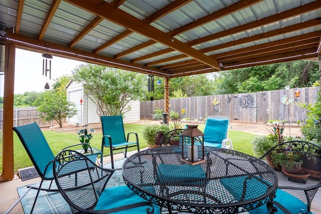 1604 Central Pkwy, Norman, OK 73071 - fenced backyard featuring a patio and a storage unit