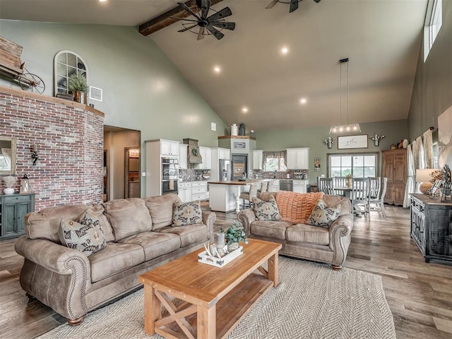 4920 W Forrest Hills Rd, Guthrie, OK 73044 - living room with high vaulted ceiling, ceiling fan, light wood-style flooring, beamed ceiling, and recessed lighting